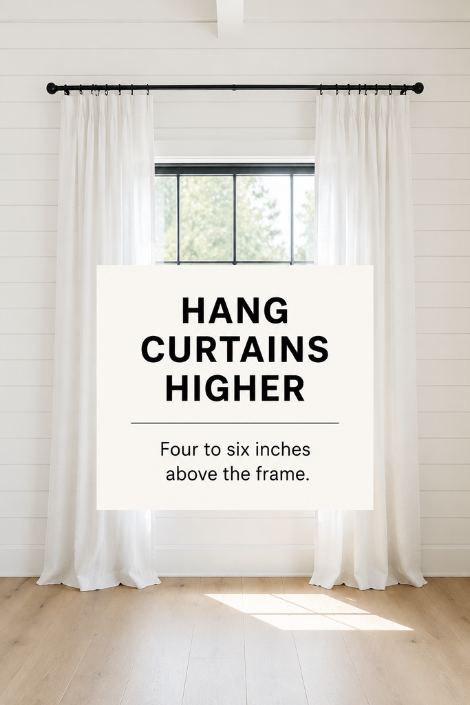 Living room curtains mounted above the window frame to make the ceiling appear higher