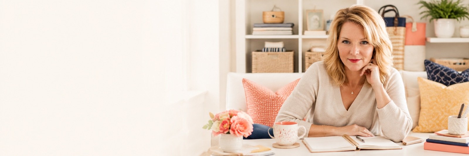 Stacey Savarese seated at a desk in a bright home office