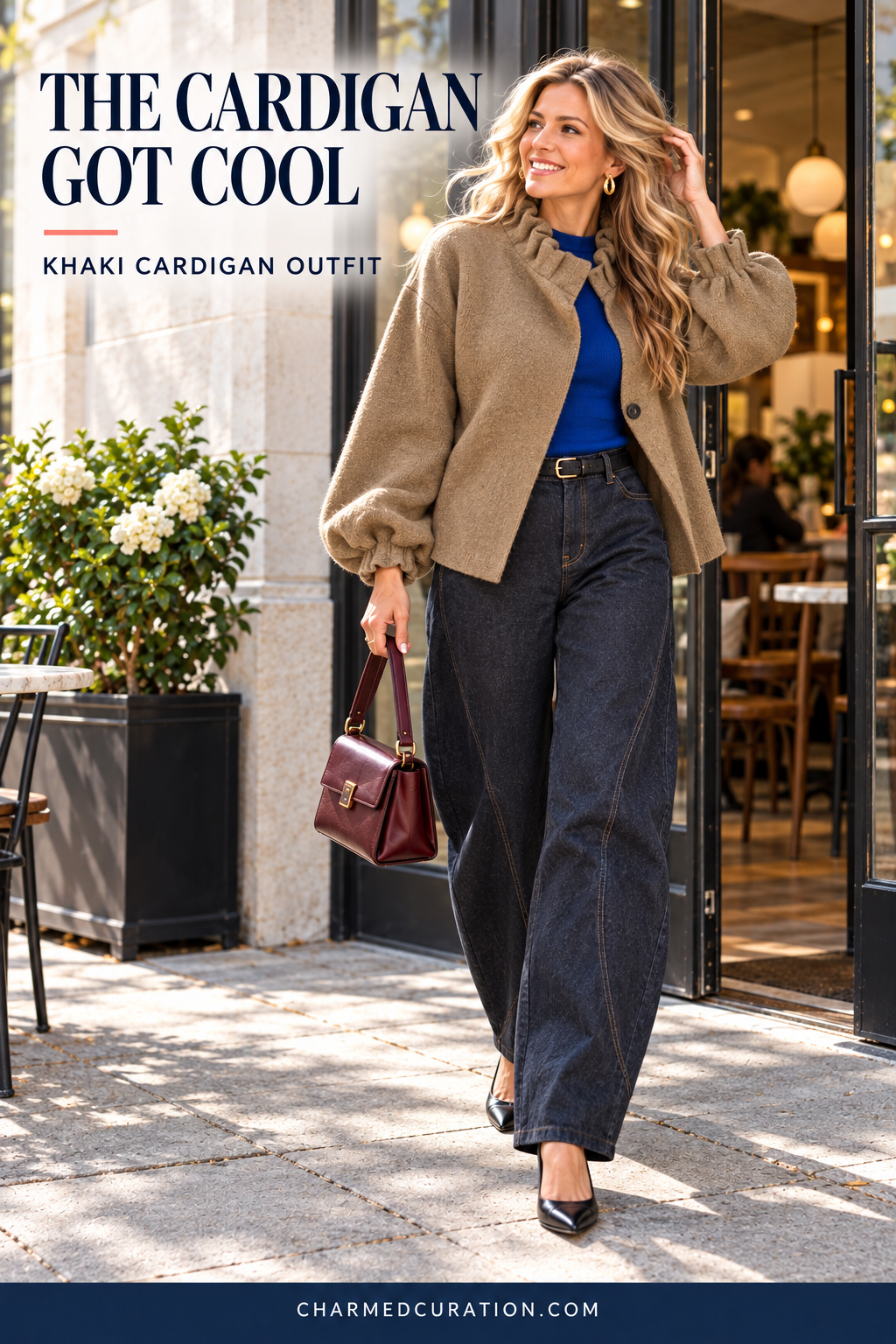 Khaki ruffle-neck cardigan over a cobalt top with dark barrel-leg jeans.