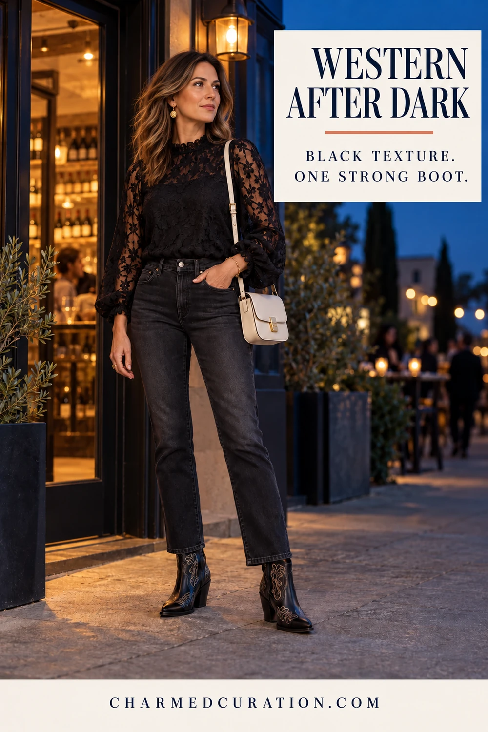 Woman wearing black embroidered cowboy boots, dark jeans, and a black lace blouse for an evening outfit.